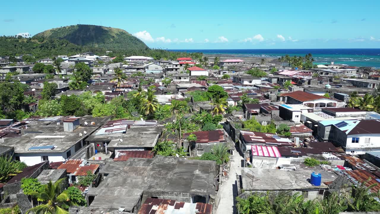 Aerial View Of Small Town Slum In Comoros, Populated Urban Residential Area With Dense Houses and Sheet Roofs