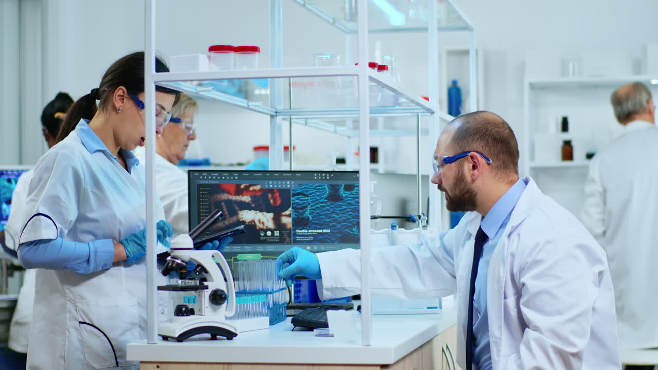 Team of medical researcher conducting experiments using test tubes