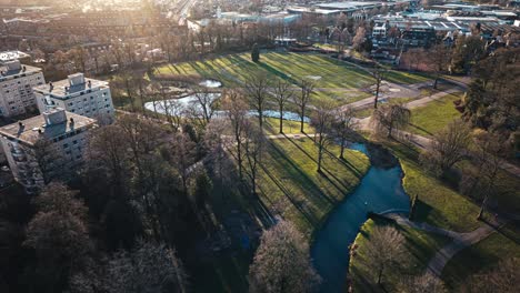 Aerial-hyperlapse-showing-buildings,-cars-and-city-landscape