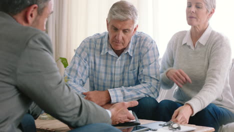 financial consultation with elderly couple