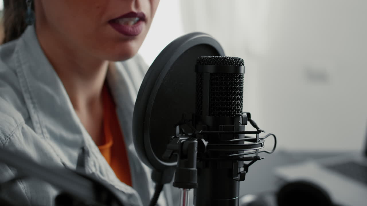 Popular internet live radio talk show host talking to public at microphone