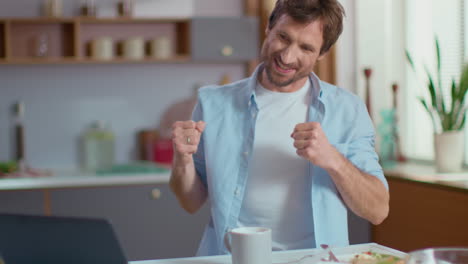 man celebrating good news