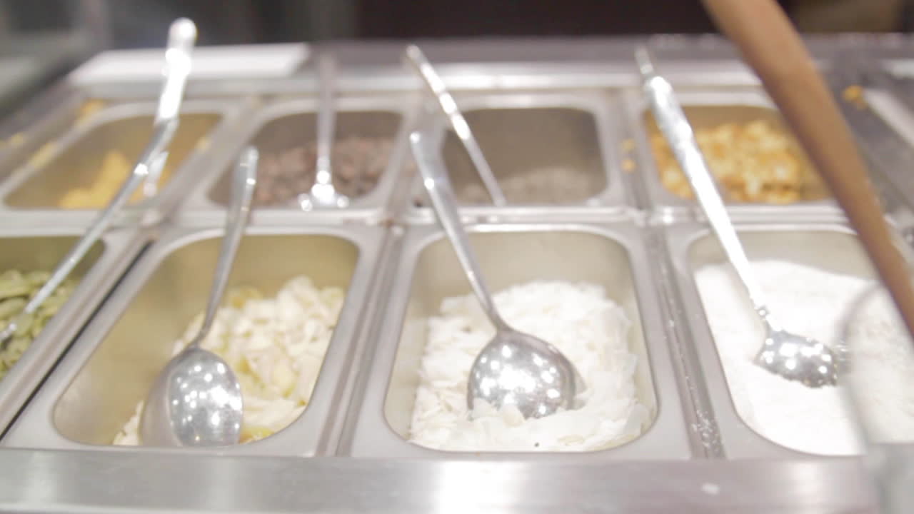 Making a Delicious Frozen Yogurt Parfait with Toppings