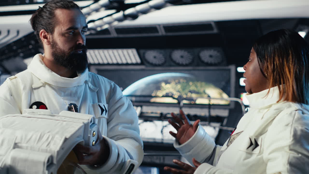 Astronaut puts helmet on before leaving space station, fist bumping colleague