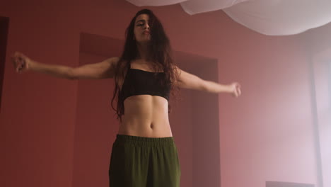 Young-woman-dancing-in-a-classroom