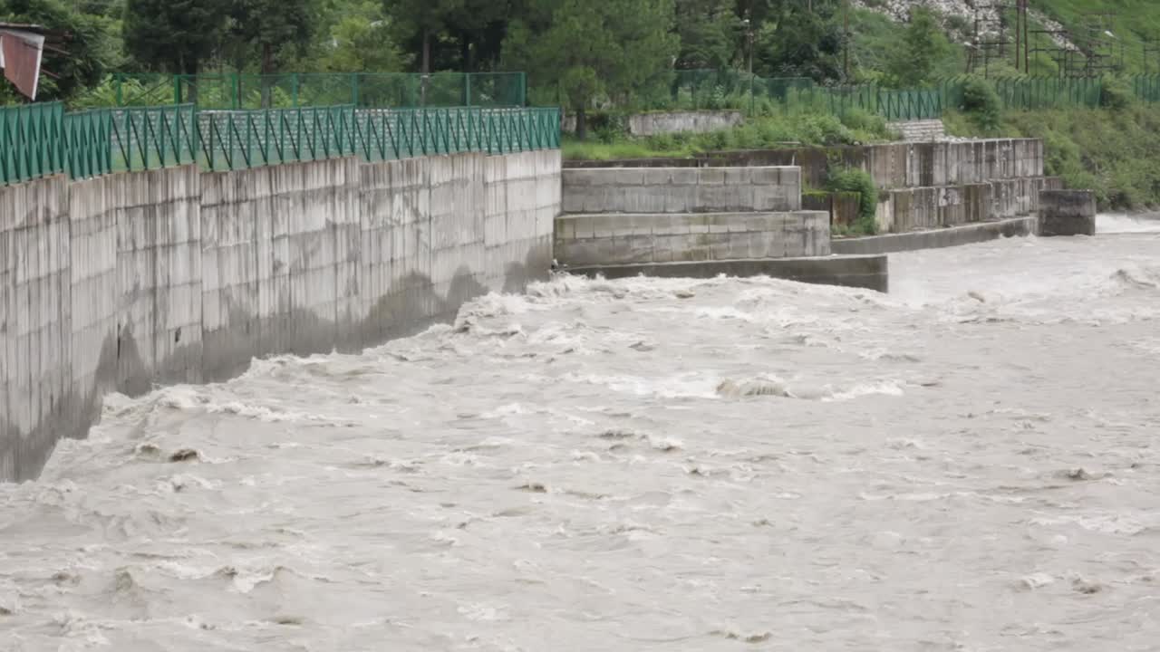 Himalaya mountainous river Ganges flowing through Himalaya villages - cities in Uttarakhand, India.
