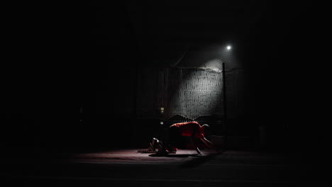 athlete preparing to sprint at night