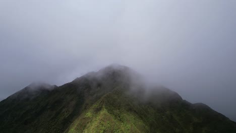 nu‘uanu pali - clouds flowing over over ridges of cliff- stationary view