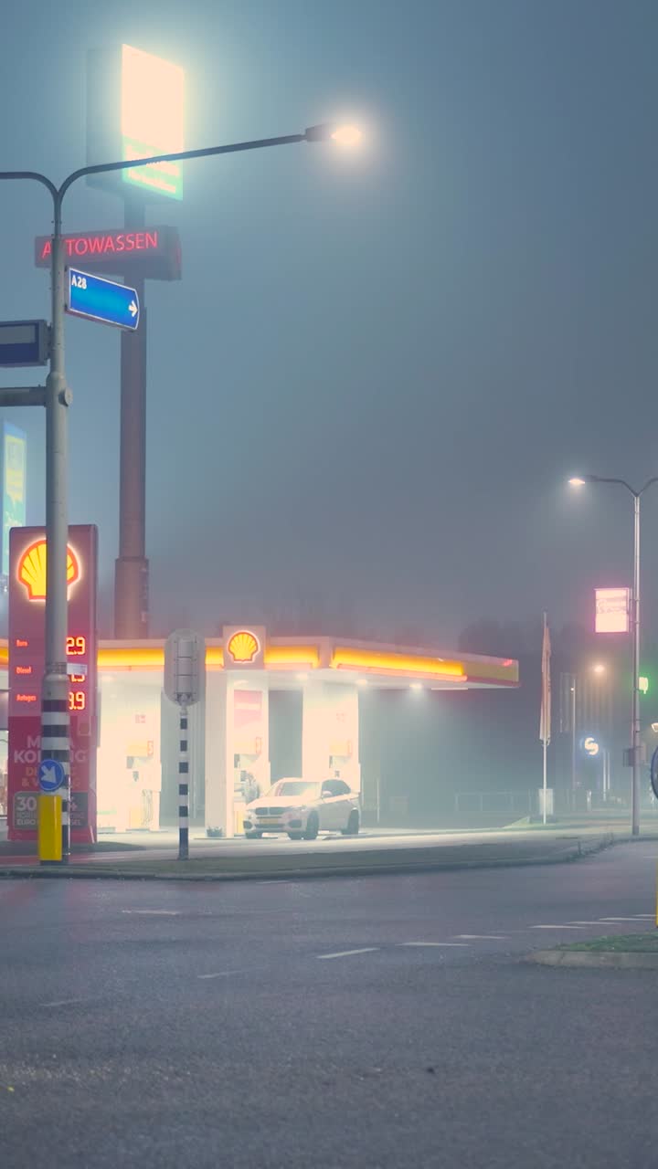 Gas station at night in fog