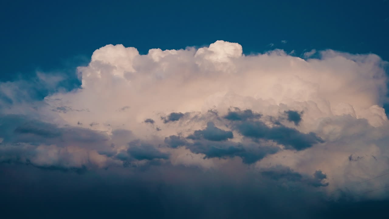 Dramatic Cloud Formation in a Deep Blue Sky