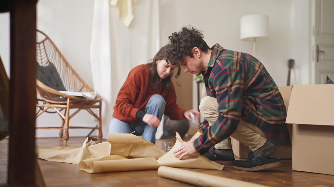 Couple Packing Boxes for a Move