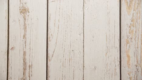 Top-view-of-spring-flowers-on-a-white-wooden-table