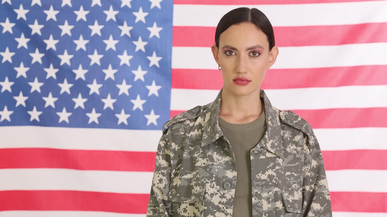 Woman in Military Uniform Standing in Front of American Flag