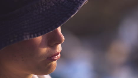 close-up of a young boy wearing a hat
