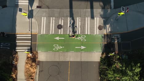 Overhead-shot-of-bikers-riding-along-a-designated-bike-lane-in-downtown-Seattle