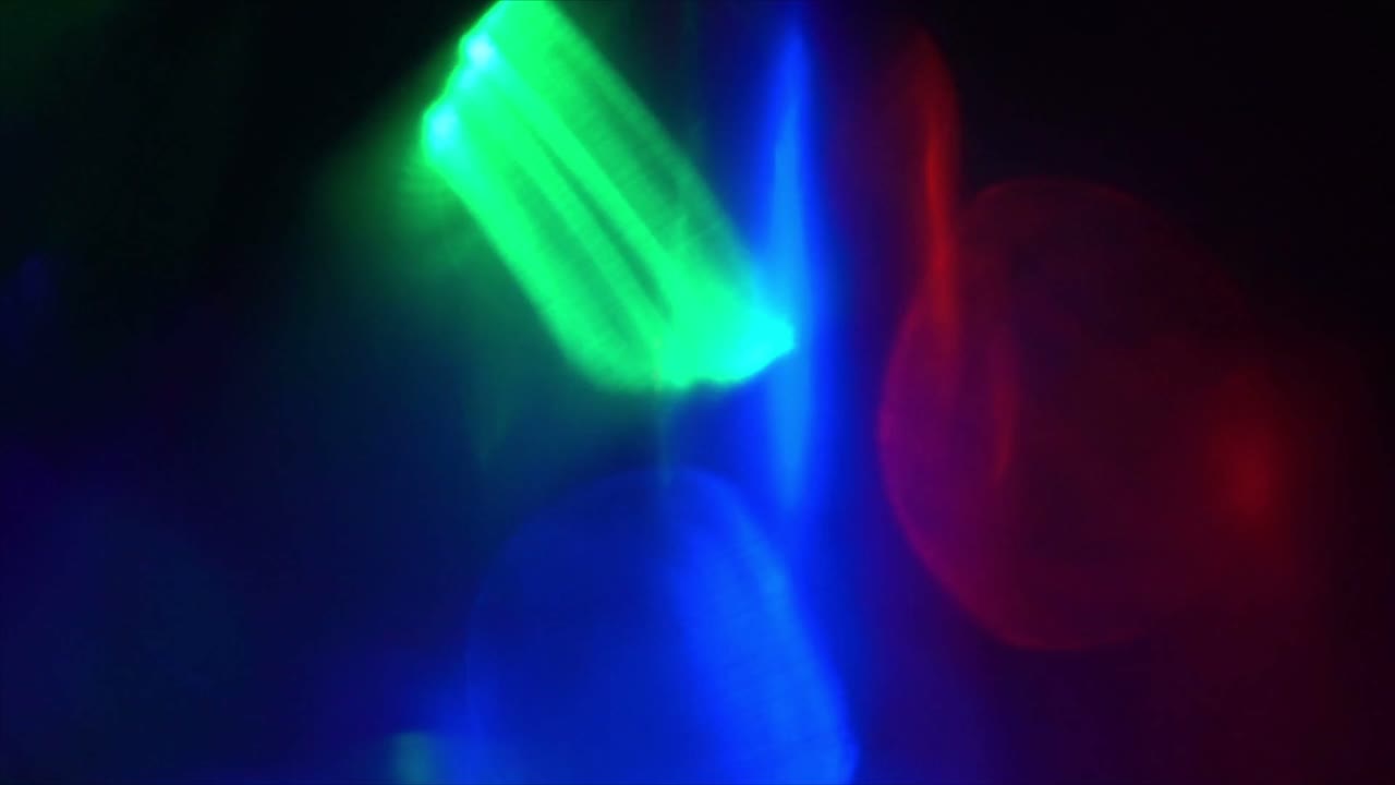 Vibrant Abstract Light Leaks and Lens Flares on Dark Background