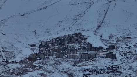 Aerial-rotating-shot-of-a-skiing-village-at-resort-at-the-base-of-the-El-Colorado