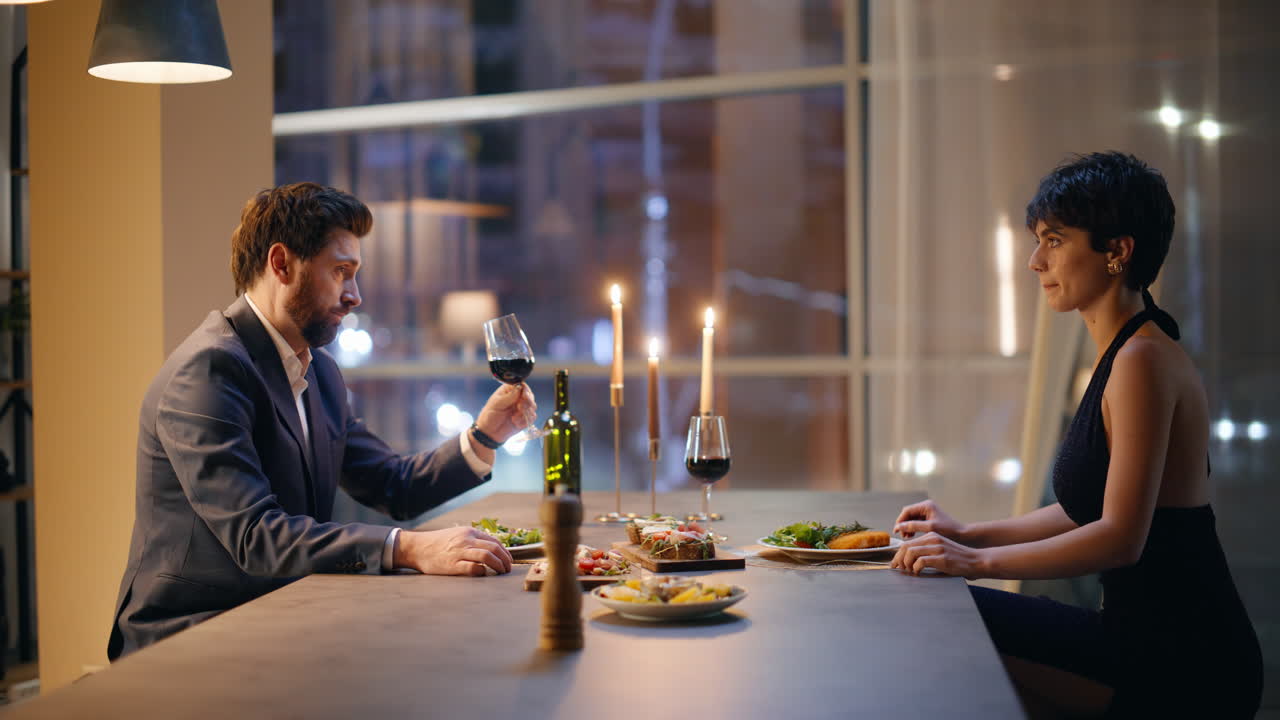 Loving people talking restaurant night city view closeup. Couple romantic date