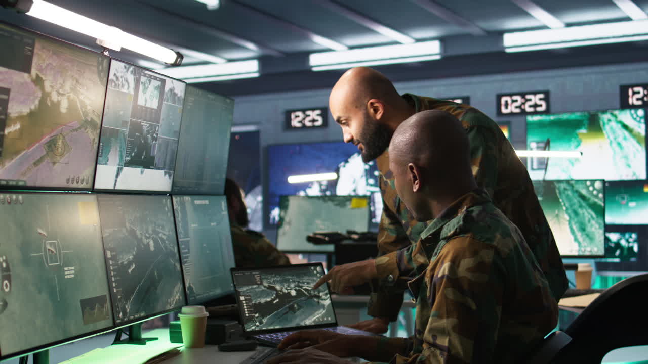 Experts using tracking gear and radar systems in command center
