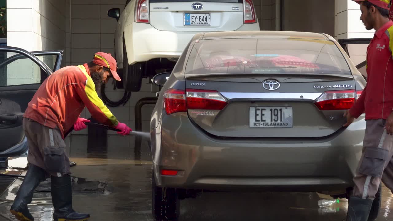 Experience a detailed car wash as dedicated staff meticulously clean the car.