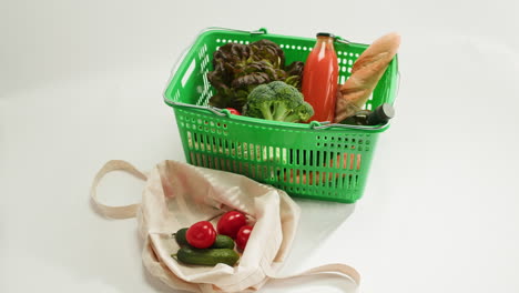 woman shopping for groceries with reusable bag