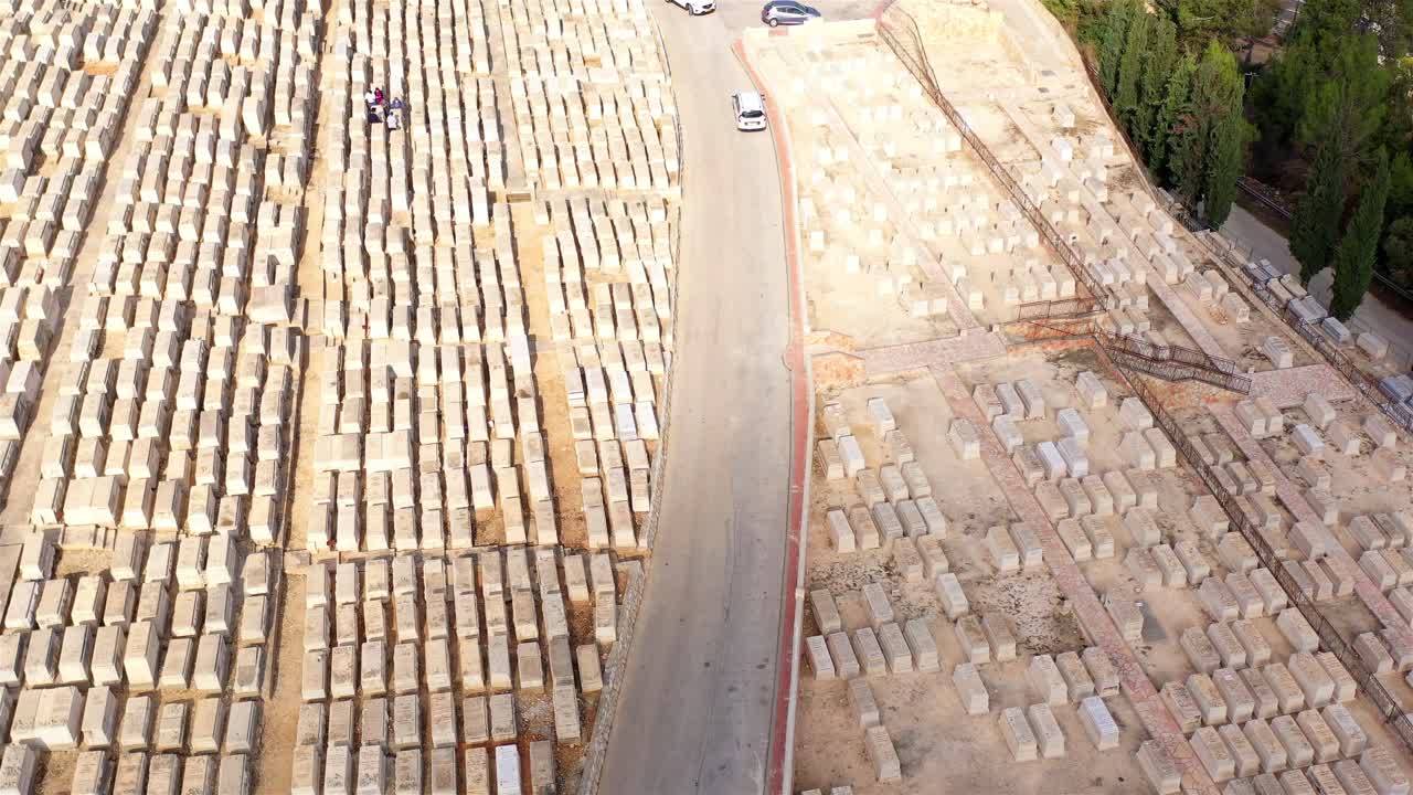 Aerial View of a Vast Cemetery with Rows of Gravestones
