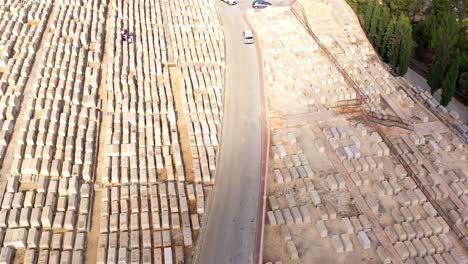 aerial view of a vast cemetery with rows of gravestones