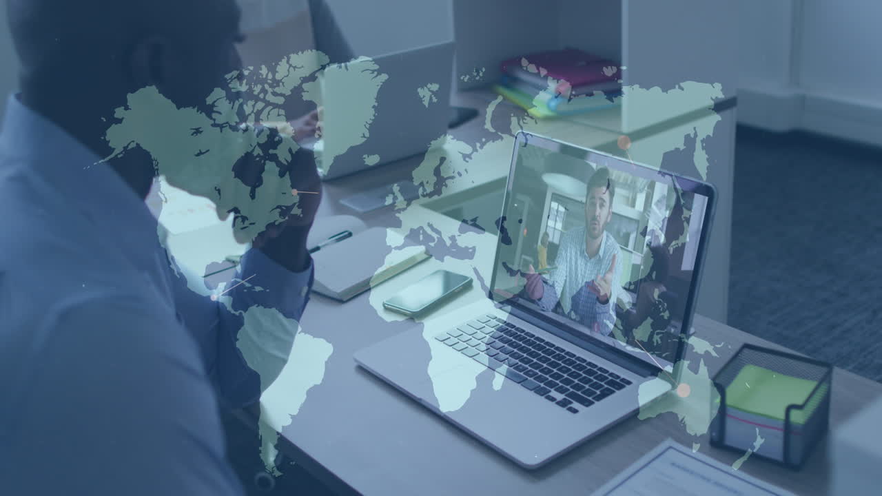 Animation of world map over african american businessman having video call