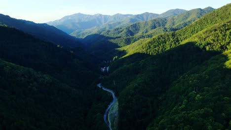 dramatic aerial view of apennine mountains cloaked in dense summer forest, italy