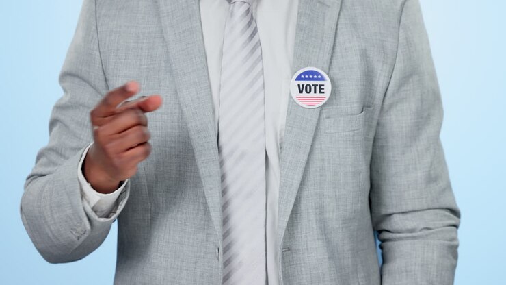 Hands, vote badge and man in politics