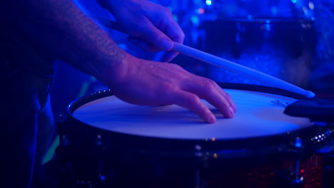 truck right of male hands making sound check of drum