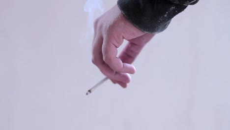 legalising cannabis smoking cigarettes with hand stock footage