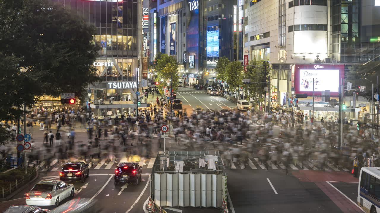 Shibuya Scramble Crossing - Traffic With Pedestrians Walking At Shibuya Crossing At Night In Tokyo City, Japan. - timelapse