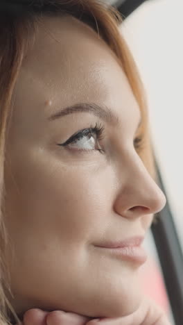 woman looking out a window