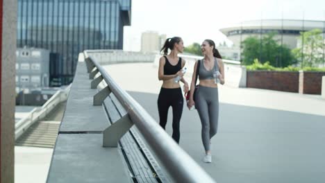 Video-of-two-women-in-training-clothes-going-to-training