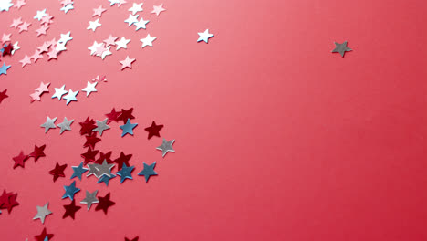 red and blue stars lying on red background with copy space