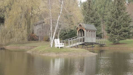 Beautiful-Island-in-the-middle-of-a-pond-with-a-wooden-bridge-spanning-across-to-it-at-Bean-Town-Ranch-Reception-venue