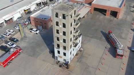 fire station training facility | aerial shot moving away | sunny day