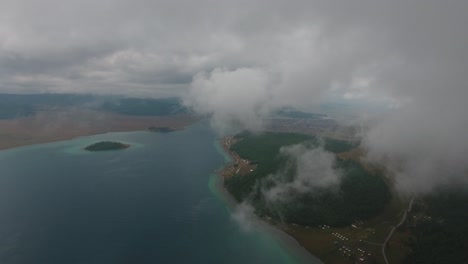 aerial drone shot clouds moving over lake in mongolia