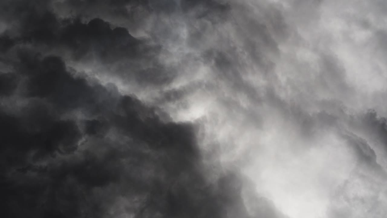 a thunderstorm with lightning that flashed through the dark clouds