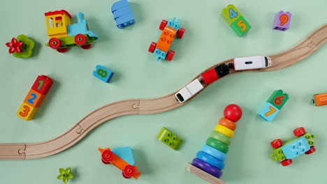 childish toy wooden railway. toy train travel along the railway. child's educational toys. top view. copy space