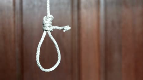 commit suicide concept, hangman's noose knot hang from the ceiling