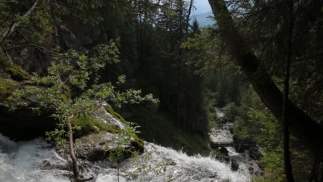 tilt on waterfall of vallesinella and landscape, madonna di campiglio, trentino alto adige, italy