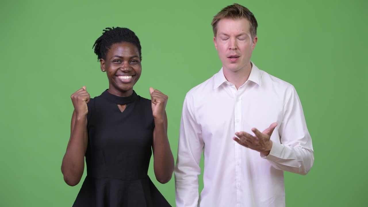 Two young multi-ethnic business couple together