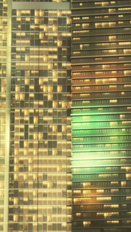 closeup of illuminated skyscrapers at night