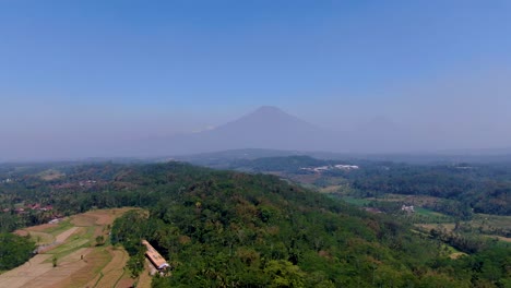 Lush-vegetation-of-Grabag-village-with-Sumbing-and-Sindoro-mounts-shrouded-in-fog-in-background