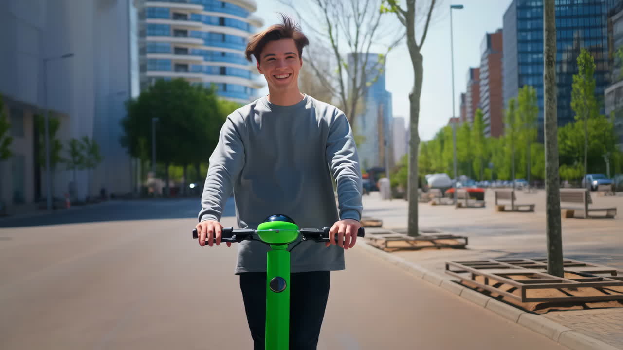 Young Man Riding an Electric Scooter in the City