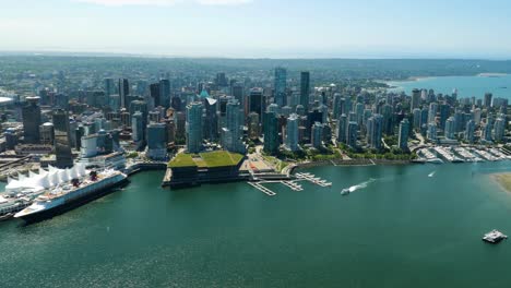 Breathtaking-Bird's-eye-view-of-the-iconic-Coal-Harbour,-one-of-the-most-picturesque-and-popular-destinations-in-Vancouver,-BC,-Canada,-with-its-bustling-marina,-and-beautiful-waterfront-attractions