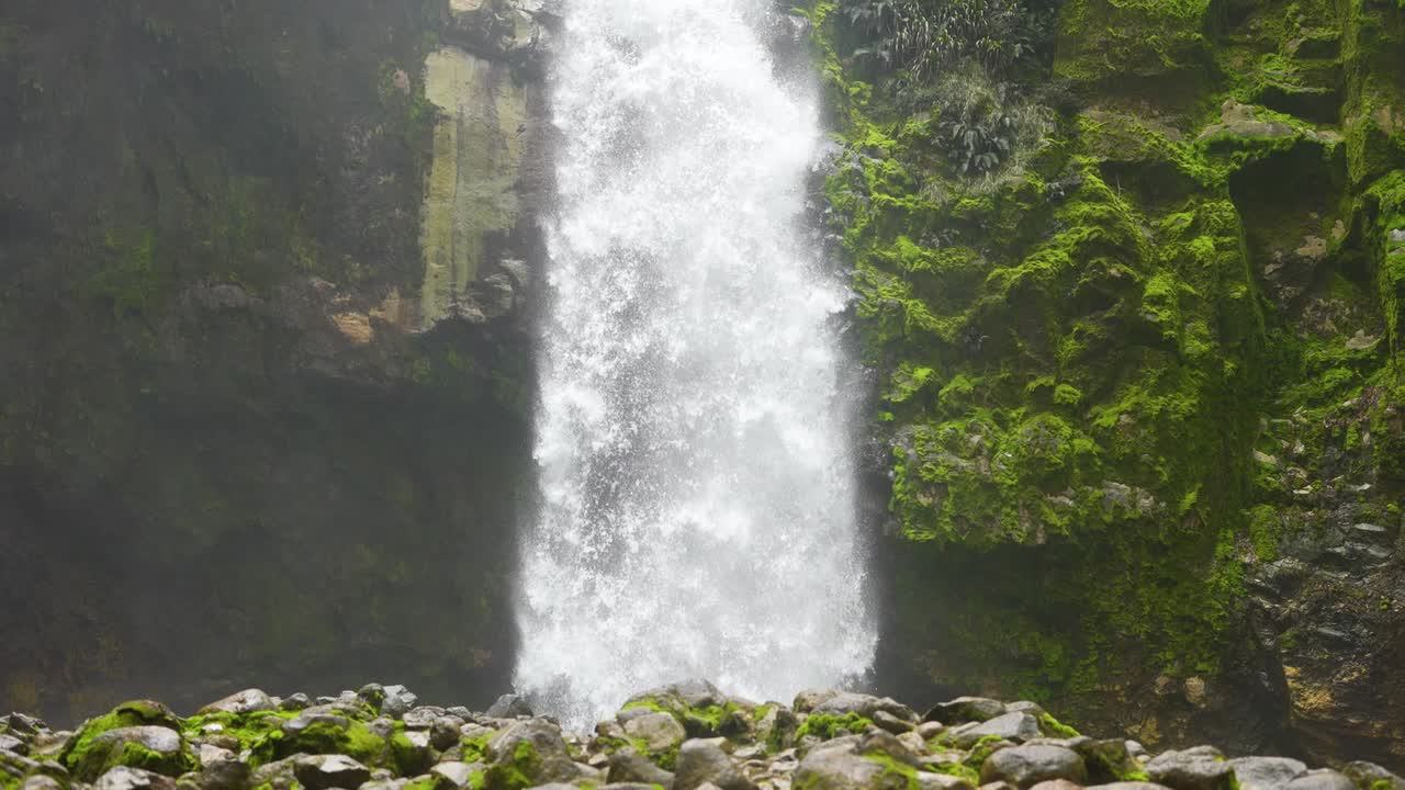 waterfall in the mountain with river. forest river rocks. The river flows between the rocks. View of the forest river waterfall