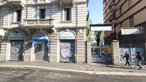 cars and pedestrians on a milan street